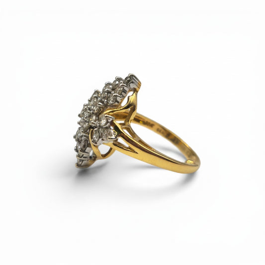 18ct yellow gold diamond ring by Reeves and Sons, featuring a sparkling diamond centerpiece and elegant band design.
