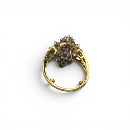 18ct yellow gold diamond ring by Reeves and Sons featuring sparkling diamonds set in a classic band design.