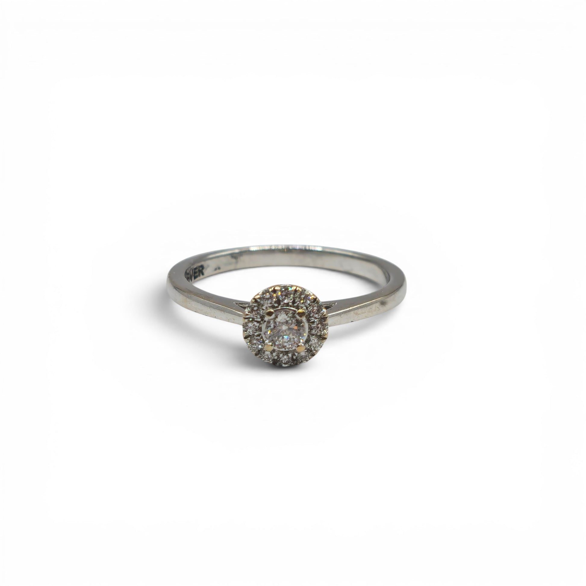 18ct white gold diamond ring by Reeves and Sons with sparkling diamonds and elegant design, shown in close-up.