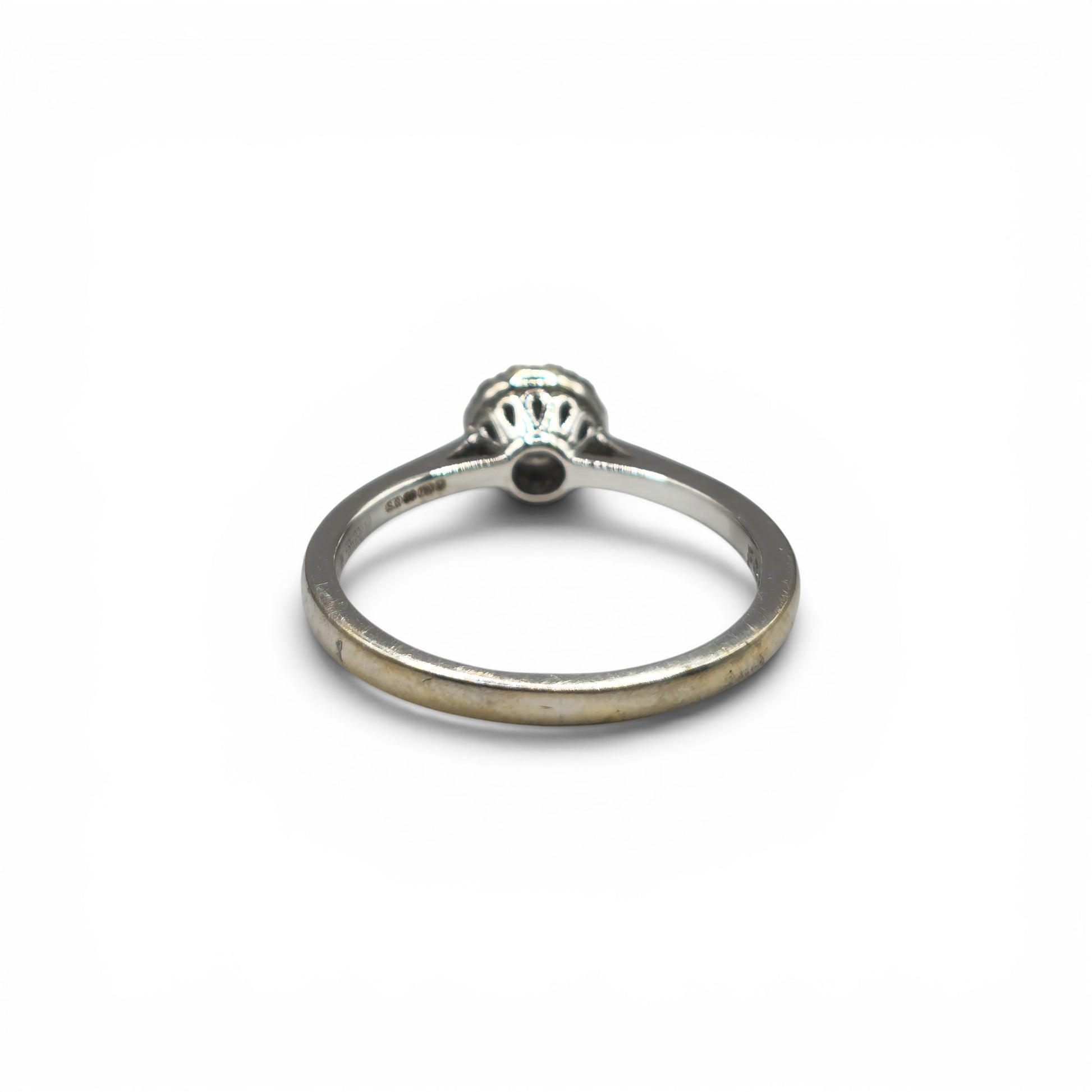 18ct white gold diamond ring by Reeves and Sons, featuring sparkling diamonds and a sleek, elegant design.