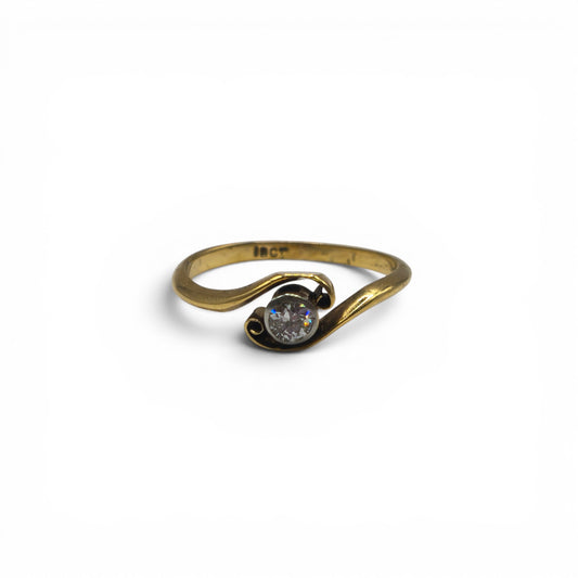 18ct yellow gold diamond ring by Reeves and Sons with sparkling diamonds on a sleek band.