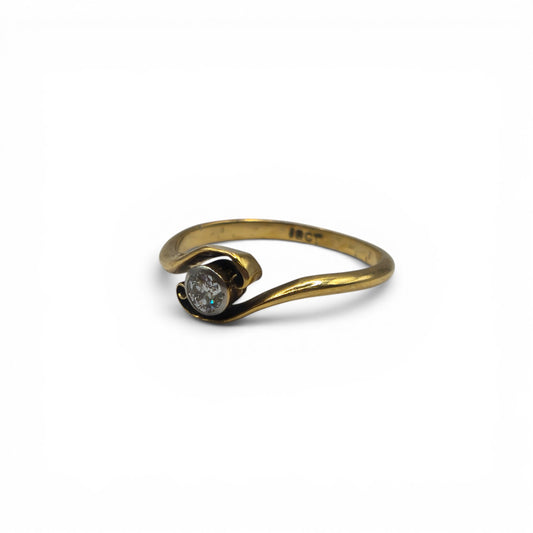 18ct yellow gold diamond ring by Reeves and Sons featuring sparkling diamonds and a classic design.