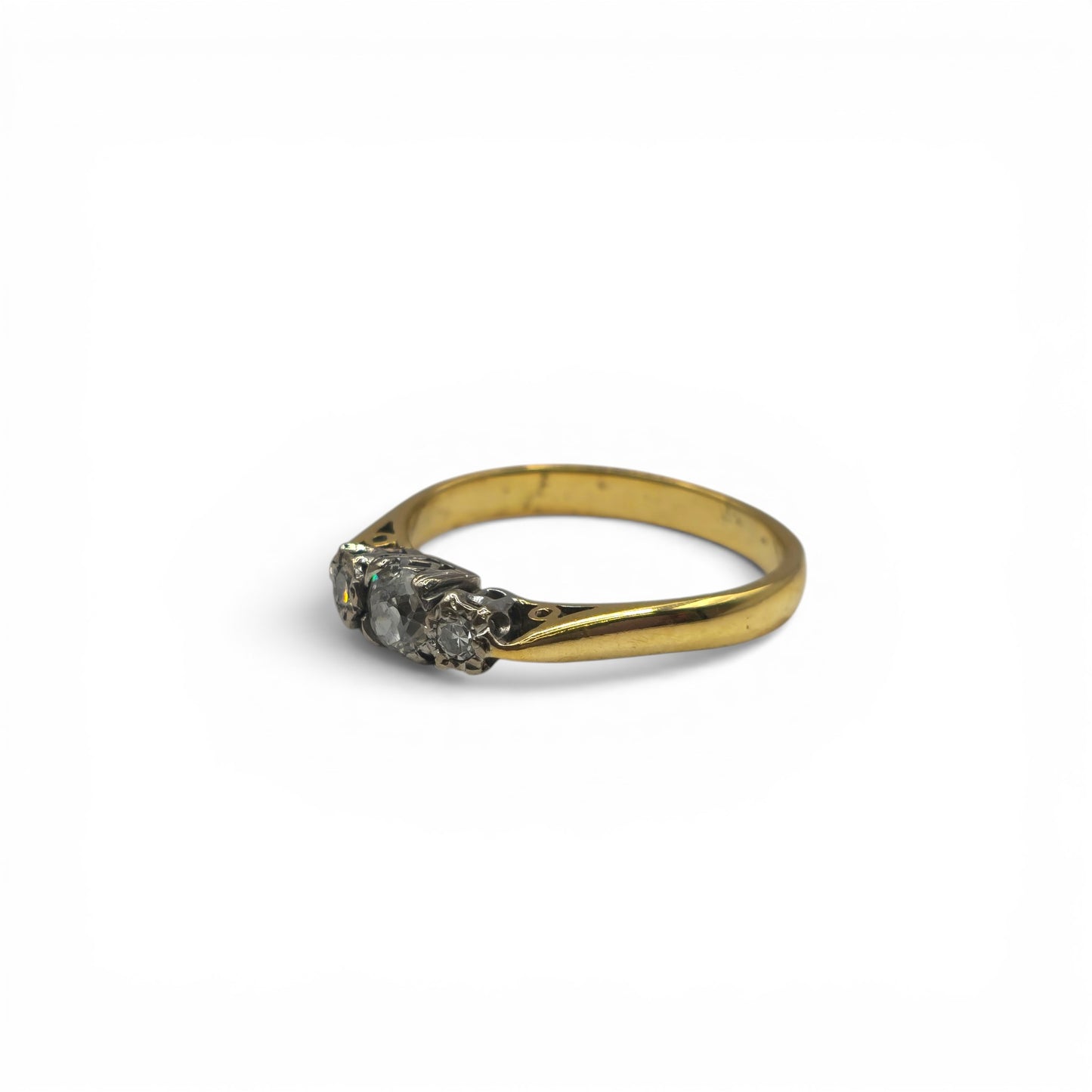 18ct yellow gold diamond ring by Reeves and Sons, featuring sparkling diamonds and a sleek band design.