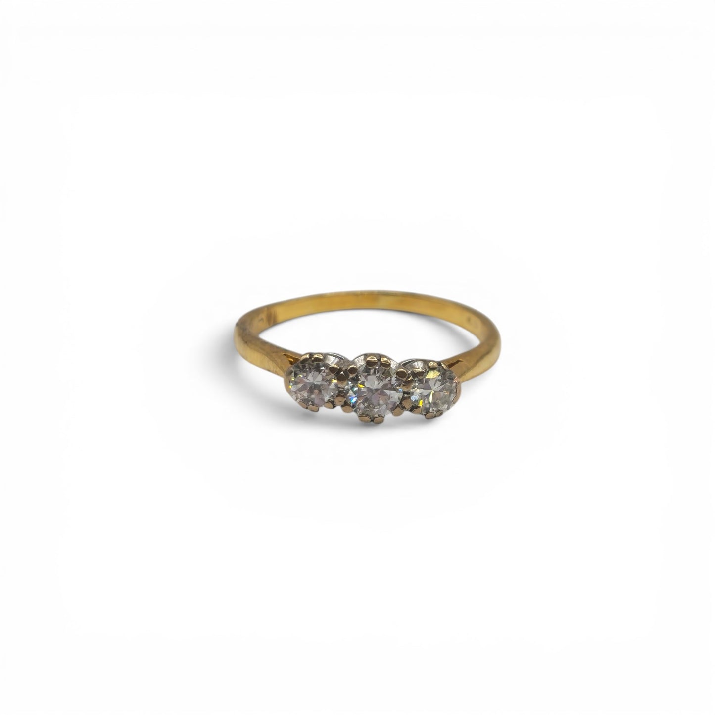 18ct yellow gold 3 stone diamond ring by Reeves and Sons, showcasing sparkling diamonds and elegant design.
