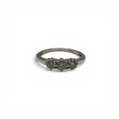 18ct white gold diamond ring by Reeves and Sons with sparkling diamonds, showcasing elegant jewelry design.