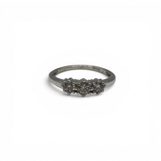 18ct white gold diamond ring by Reeves and Sons with sparkling diamonds, showcasing elegant jewelry design.
