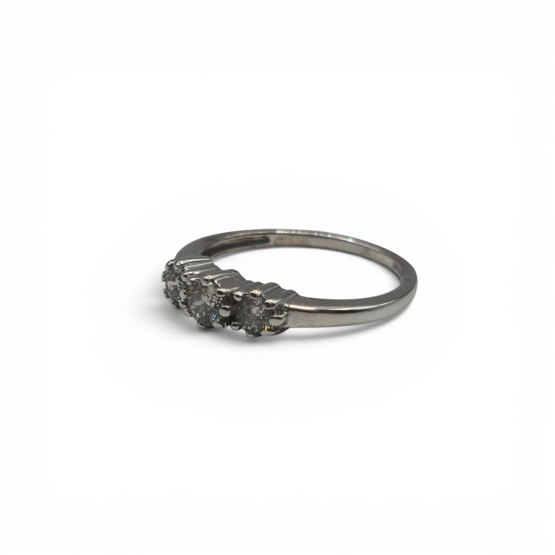 18ct white gold diamond ring by Reeves and Sons, featuring sparkling diamonds set in a elegant band.