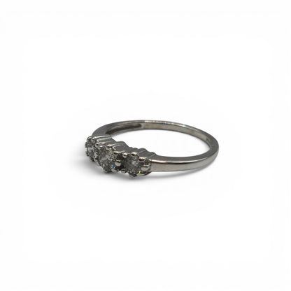 18ct white gold diamond ring by Reeves and Sons, featuring sparkling diamonds set in a elegant band.