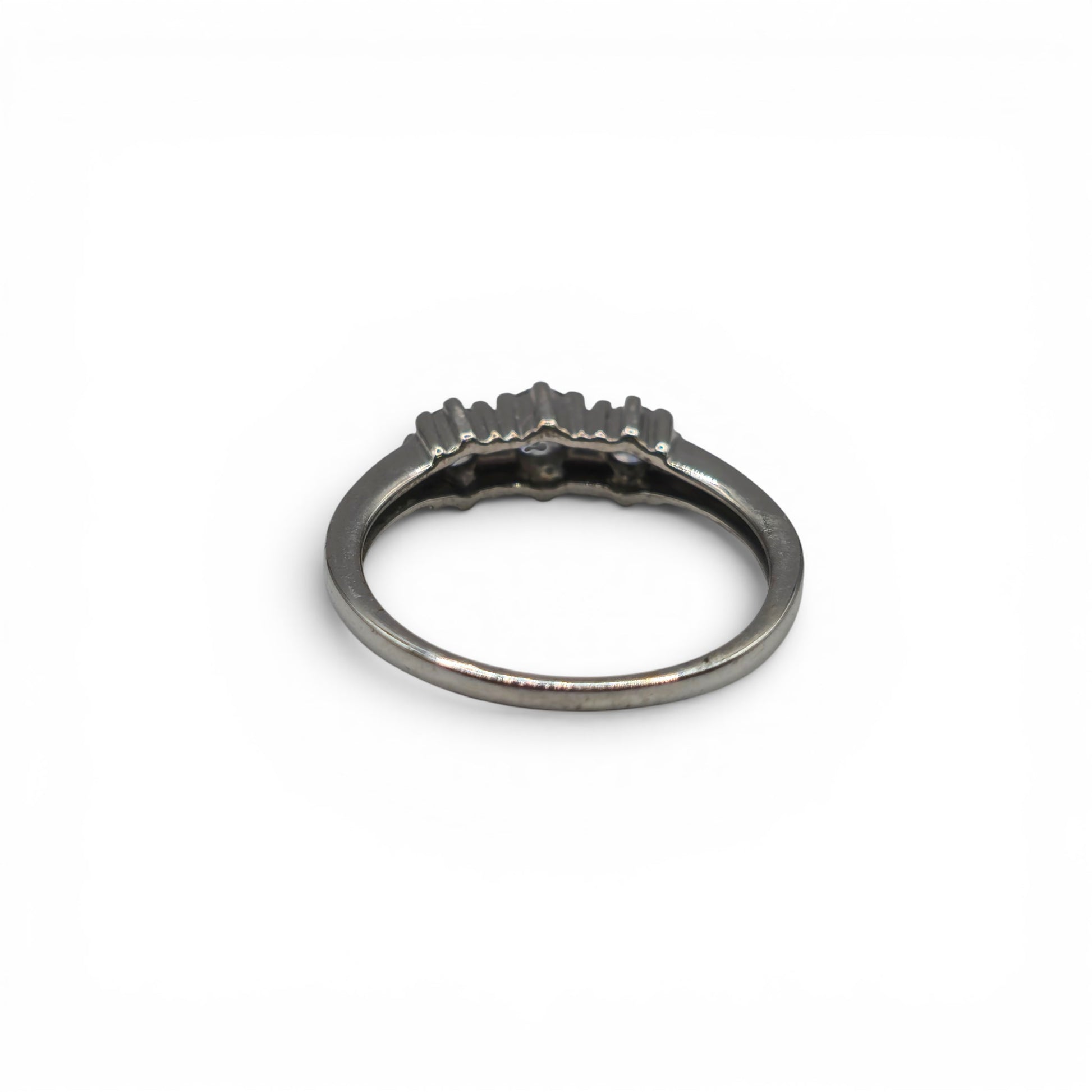 18ct white gold diamond ring by Reeves and Sons, featuring sparkling diamonds and elegant design on a white background.