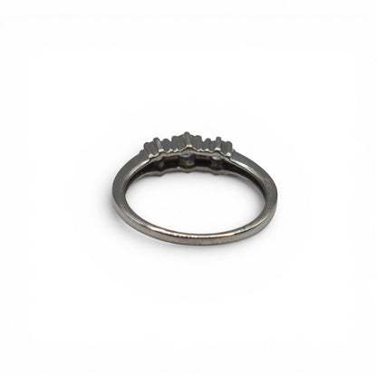 18ct white gold diamond ring by Reeves and Sons, featuring sparkling diamonds and elegant design on a white background.