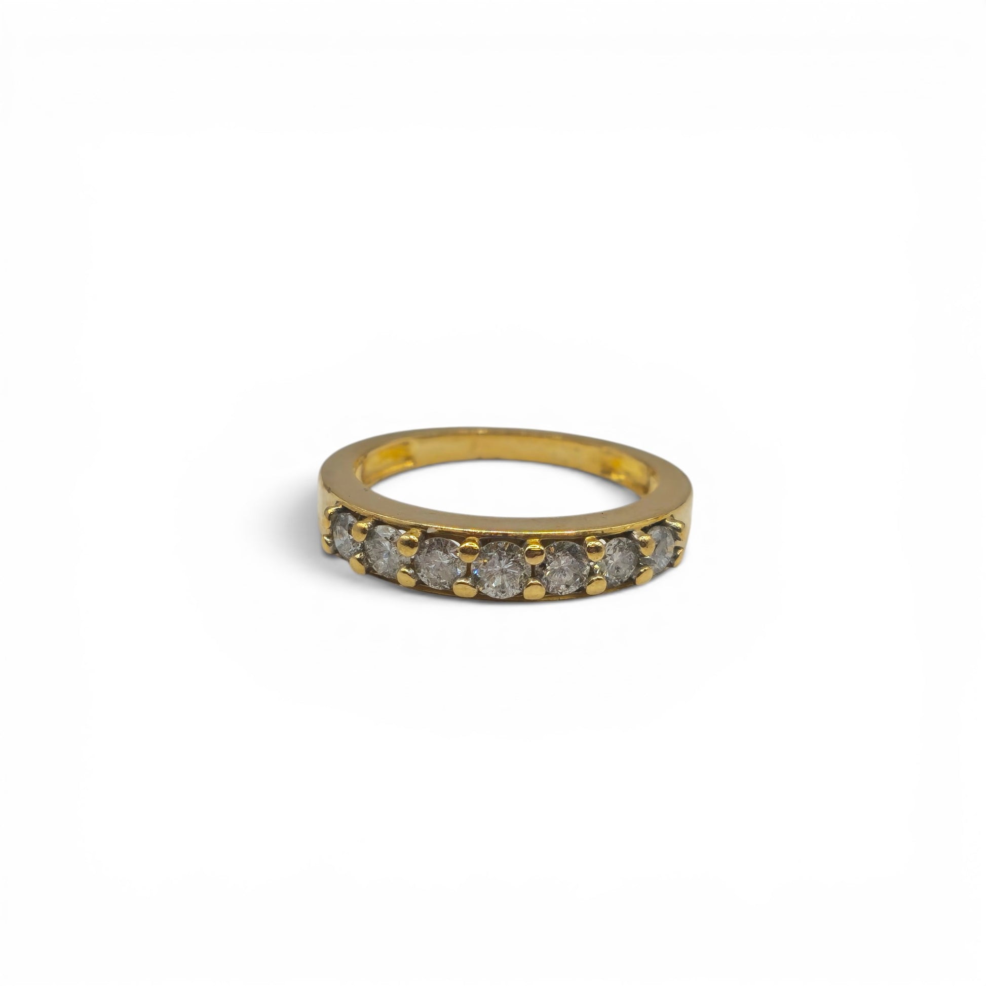 18ct yellow gold 7-stone half eternity diamond ring by Reeves and Sons, showcasing sparkling diamonds and elegant design.