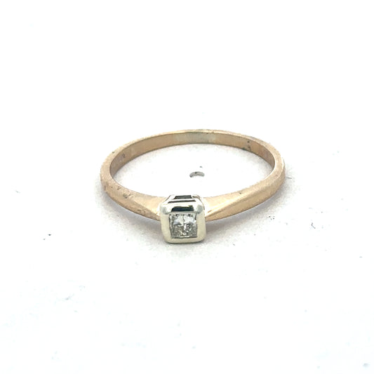 9ct yellow gold diamond ring by Reeves and Sons, featuring sparkling diamonds and elegant design, shown in close-up.