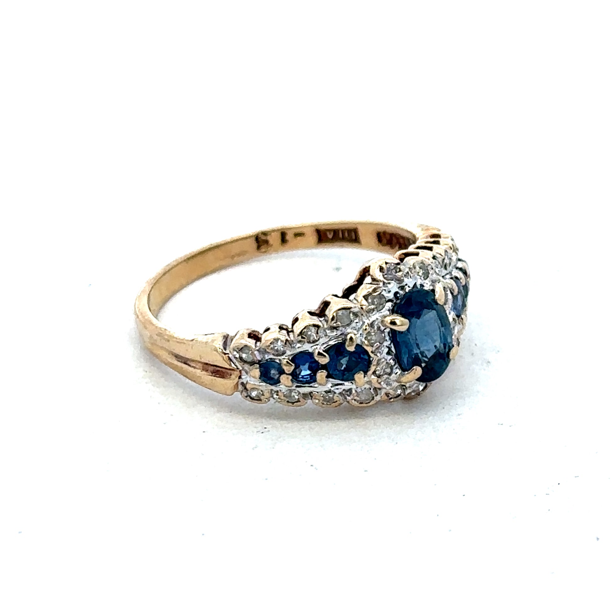 9ct yellow gold diamond ring by Reeves and Sons featuring sparkling diamonds and a classic design.