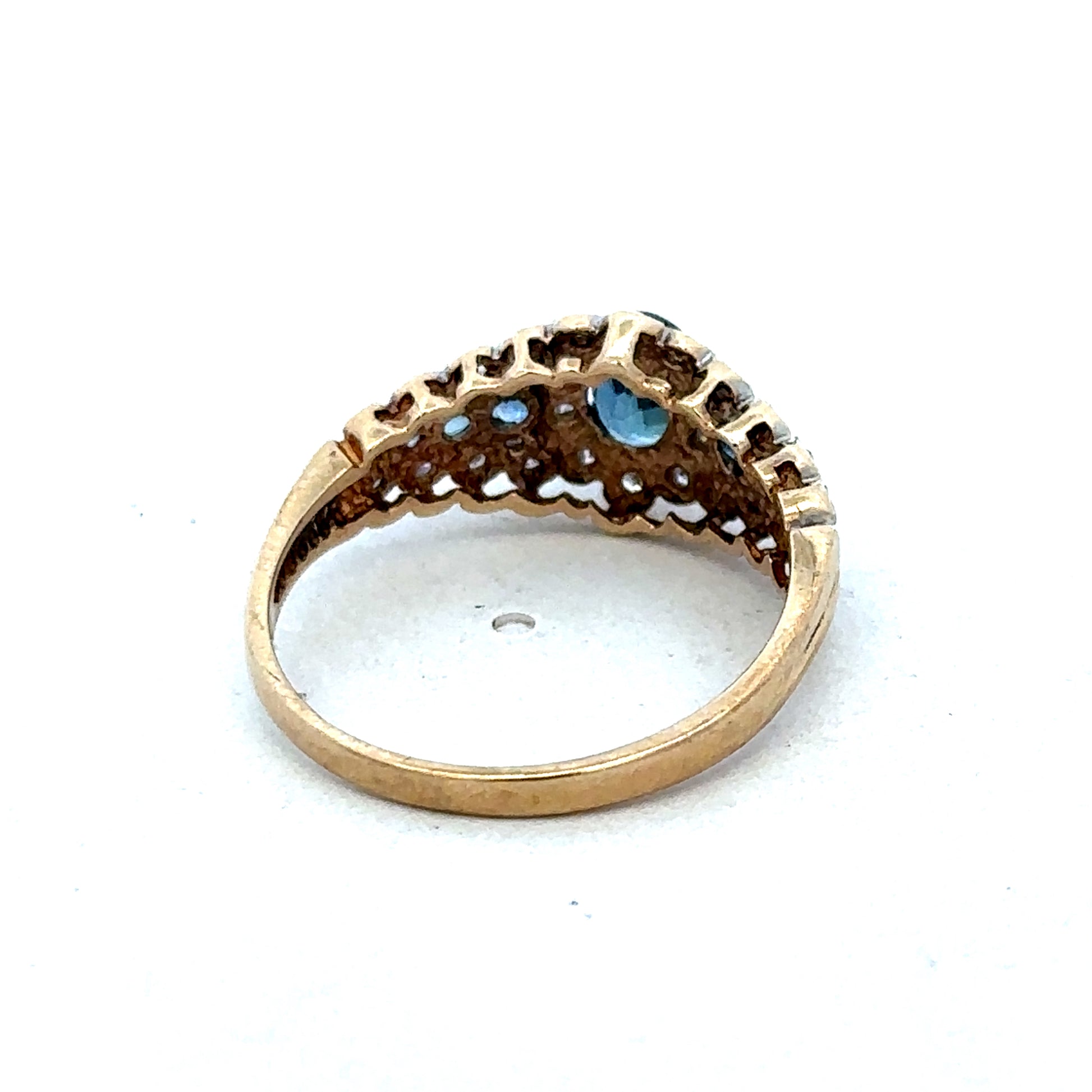 9ct yellow gold diamond ring by Reeves and Sons featuring a sparkling diamond centerpiece and elegant design.
