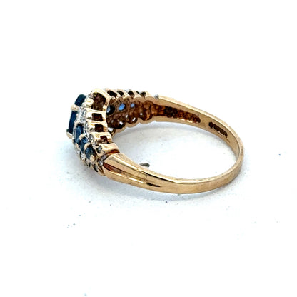 9ct yellow gold diamond ring by Reeves and Sons featuring a sparkling diamond centerpiece and elegant band design.