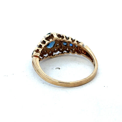 9ct yellow gold diamond ring by Reeves and Sons with sparkling diamonds, shown close-up on a white background.