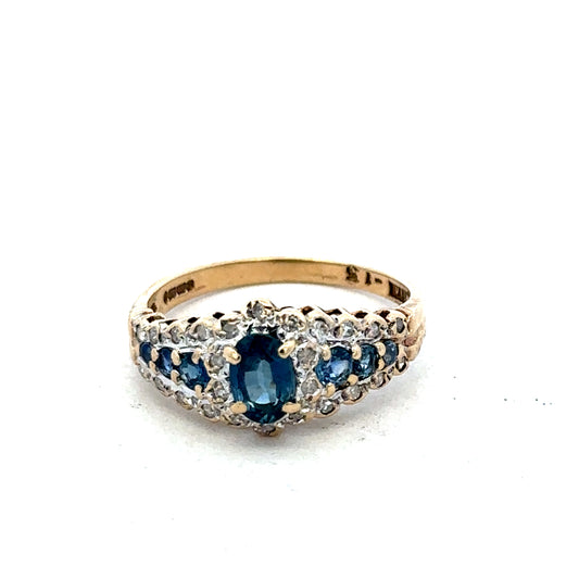 9ct yellow gold diamond ring by Reeves and Sons featuring sparkling diamonds and a classic band design.