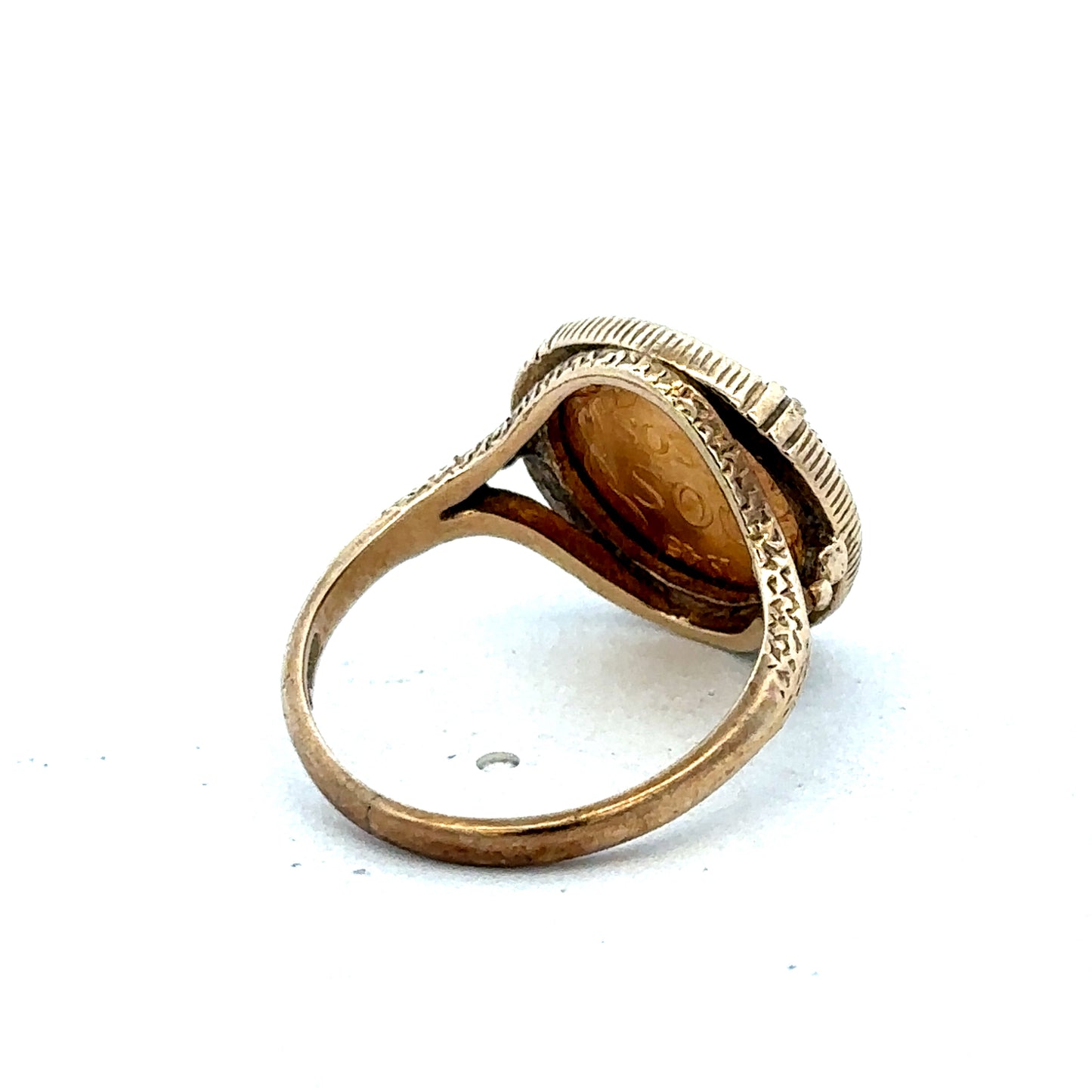 9ct gold Dos Pesos ring by Reeves and Sons featuring intricate design and polished finish, displayed on a plain background.