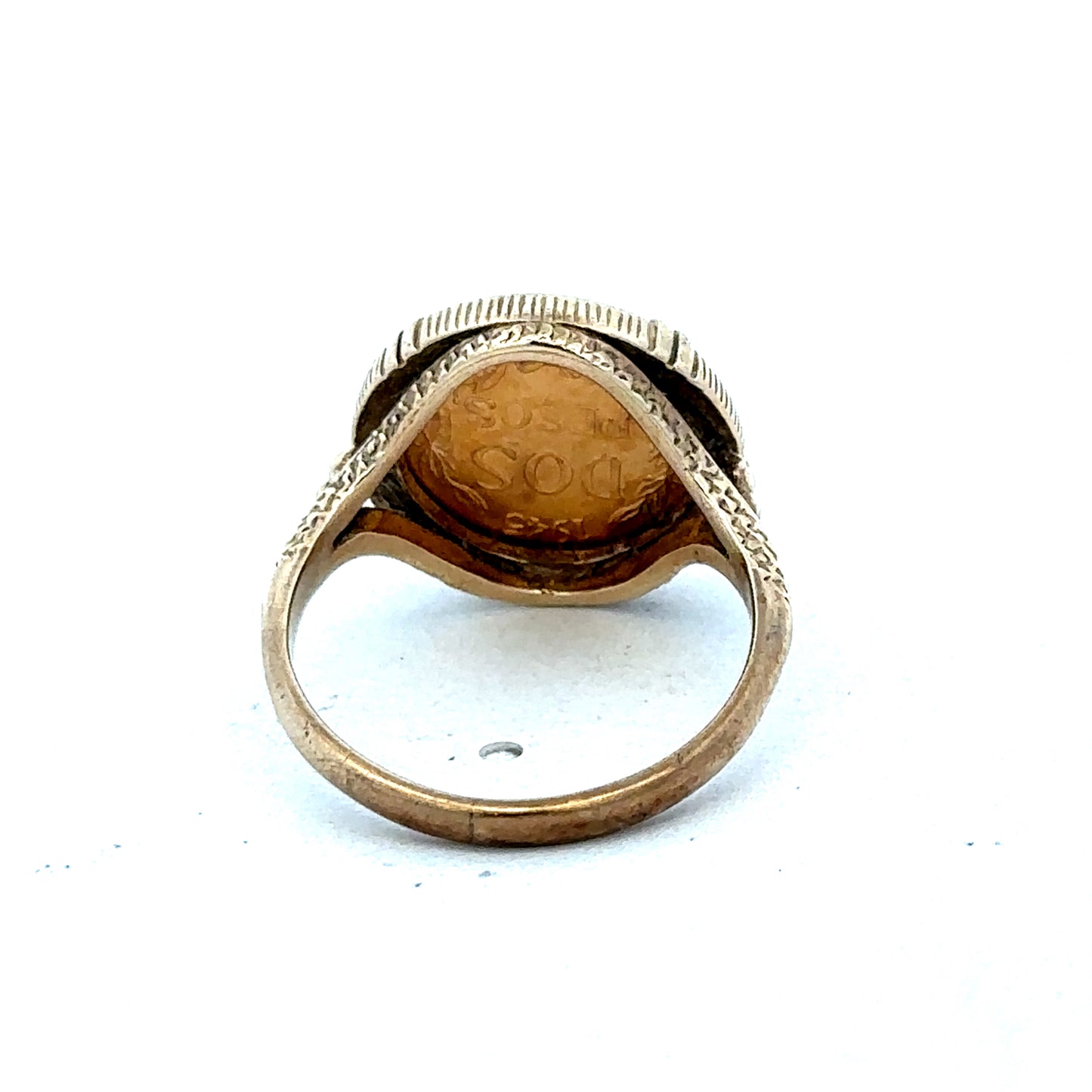 9ct gold Dos Pesos ring by Reeves and Sons, featuring intricate design and polished finish, close-up view of the ring.