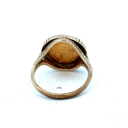 9ct gold Dos Pesos ring by Reeves and Sons, featuring intricate design and polished finish, close-up view of the ring.