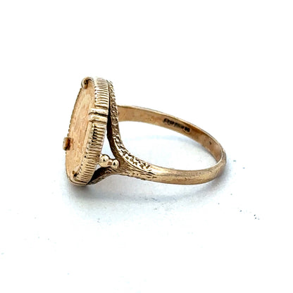 9ct gold Dos Pesos ring by Reeves and Sons, showcasing intricate design and craftsmanship, photographed against a plain background.