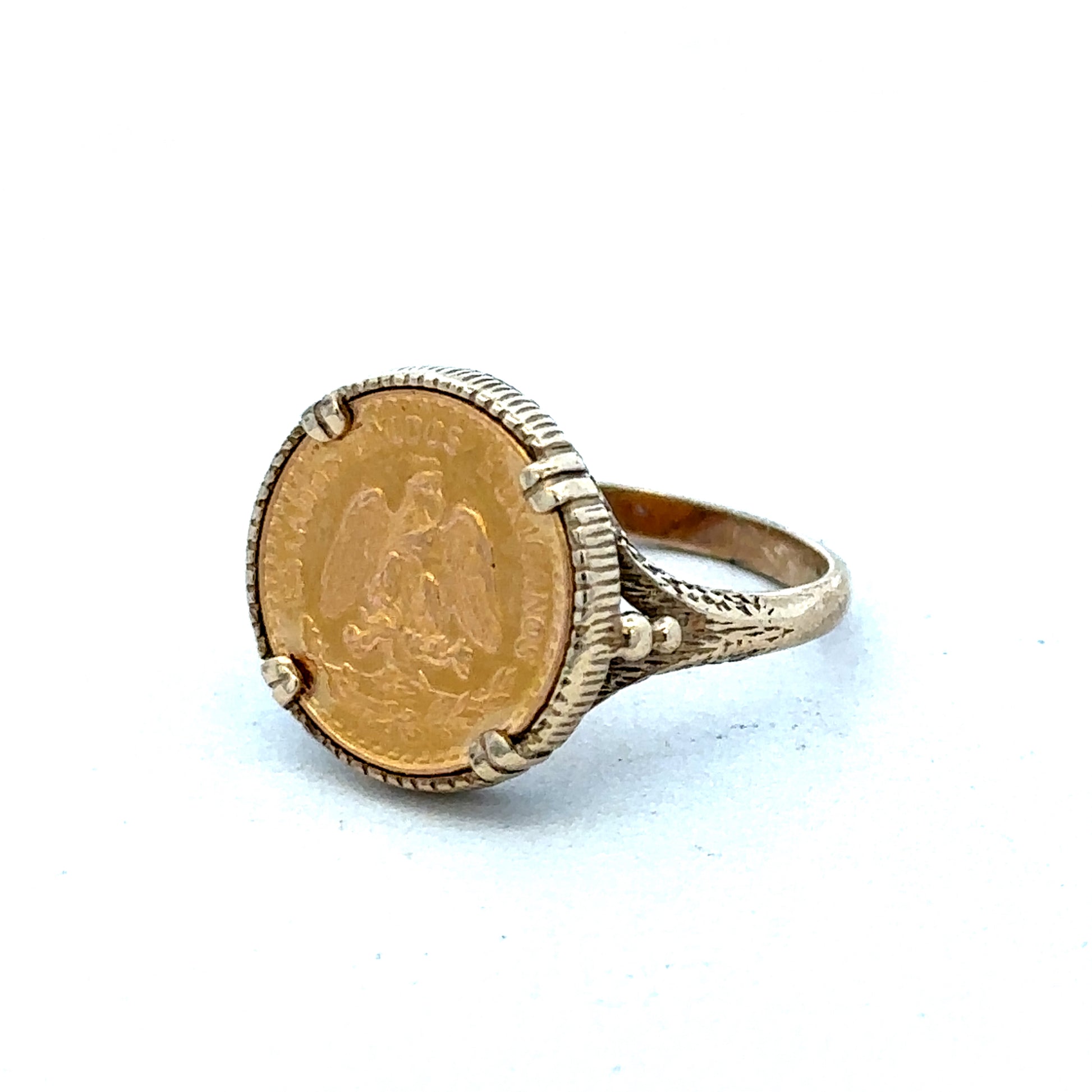 9ct gold Dos Pesos ring by Reeves and Sons, showcasing intricate design and craftsmanship, with a polished finish.