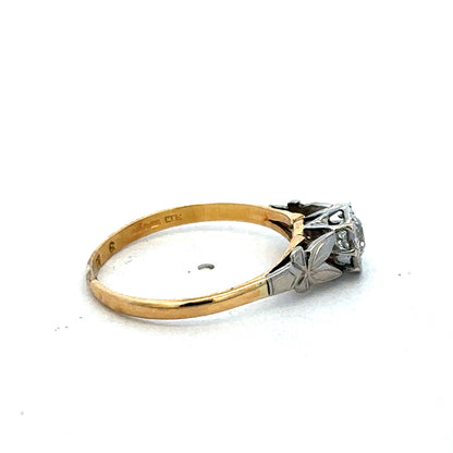 18ct yellow gold diamond ring by Reeves and Sons, featuring sparkling diamonds and a classic elegant design.
