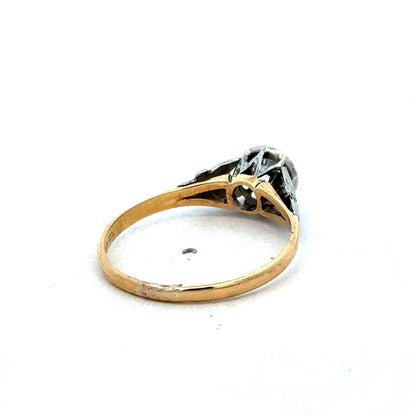 18ct yellow gold diamond ring by Reeves and Sons featuring sparkling diamonds and a sleek, elegant design.