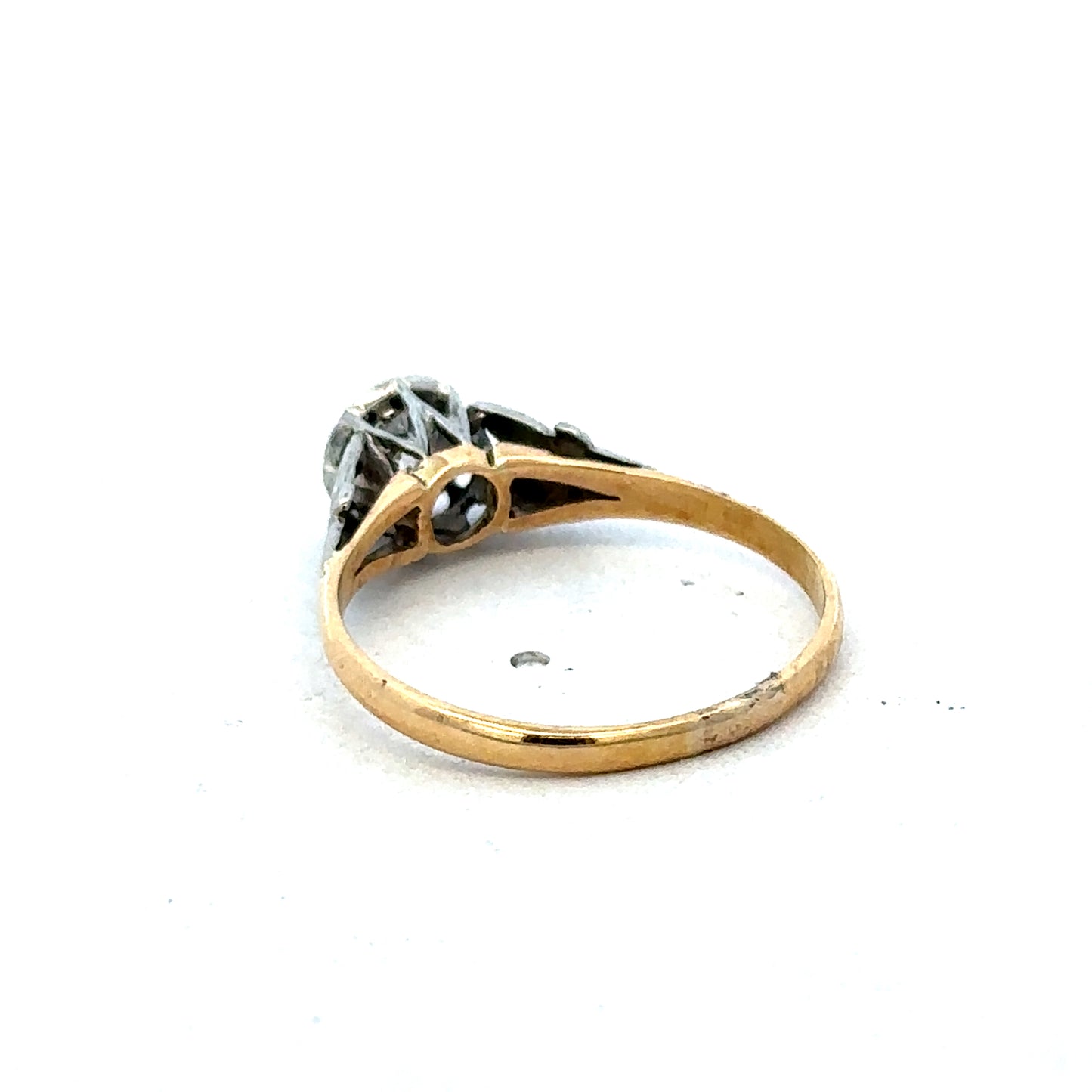 18ct yellow gold diamond ring by Reeves and Sons featuring a sparkling diamond center and elegant band design.