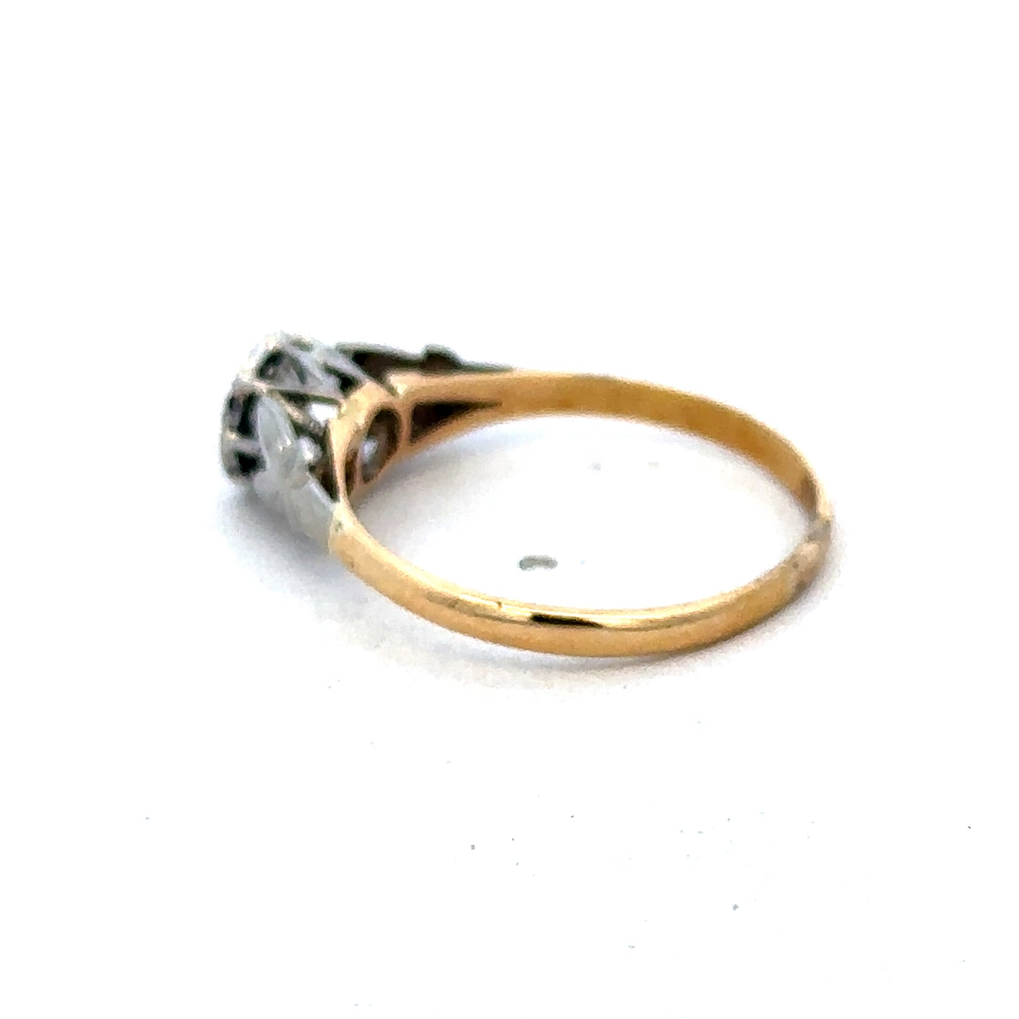 18ct yellow gold diamond ring by Reeves and Sons with sparkling diamonds, elegant design, and polished finish.