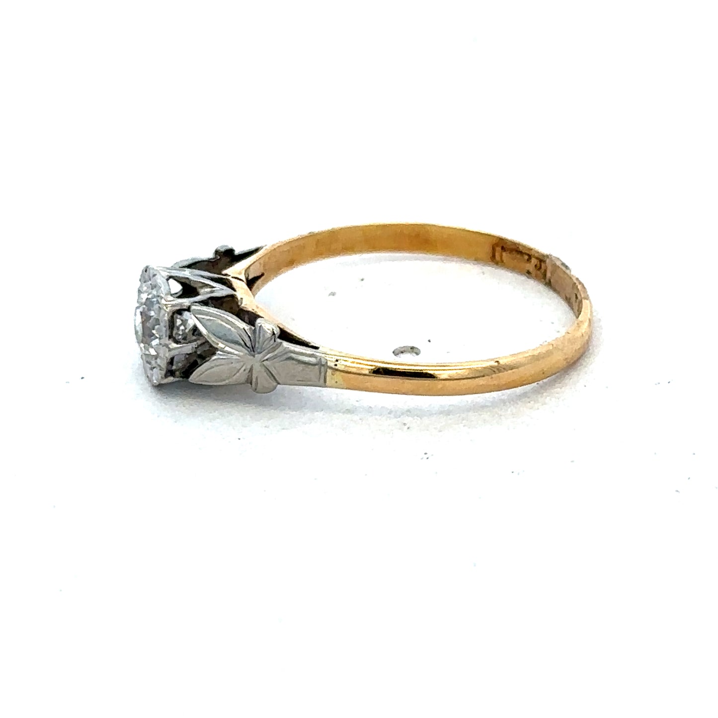 18ct yellow gold diamond ring by Reeves and Sons, featuring a sparkling diamond centerpiece and elegant design.