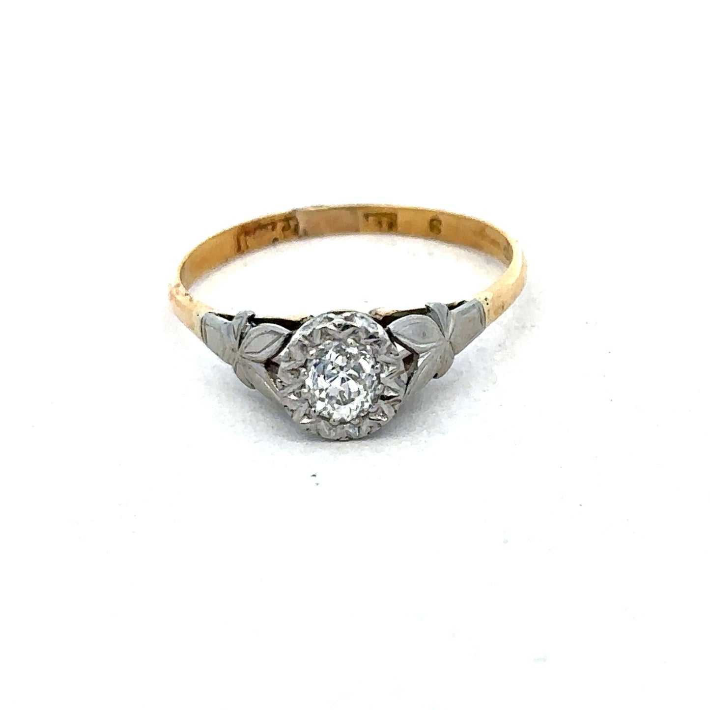 18ct yellow gold diamond ring by Reeves and Sons featuring sparkling diamonds and a sleek, elegant design.