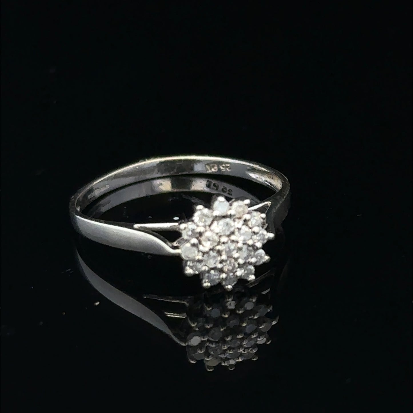 9ct white gold diamond cluster ring by Reeves and Sons, featuring a sparkling diamond cluster setting.