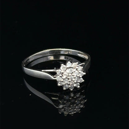 9ct white gold diamond cluster ring by Reeves and Sons, featuring a sparkling diamond cluster setting.