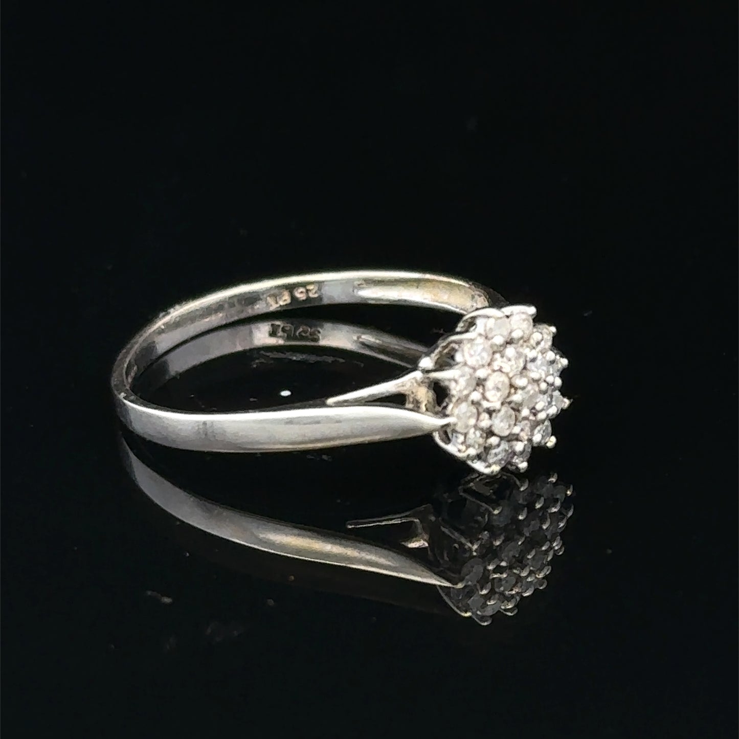 9ct white gold diamond cluster ring by Reeves and Sons, showcasing a sparkling diamond cluster design.