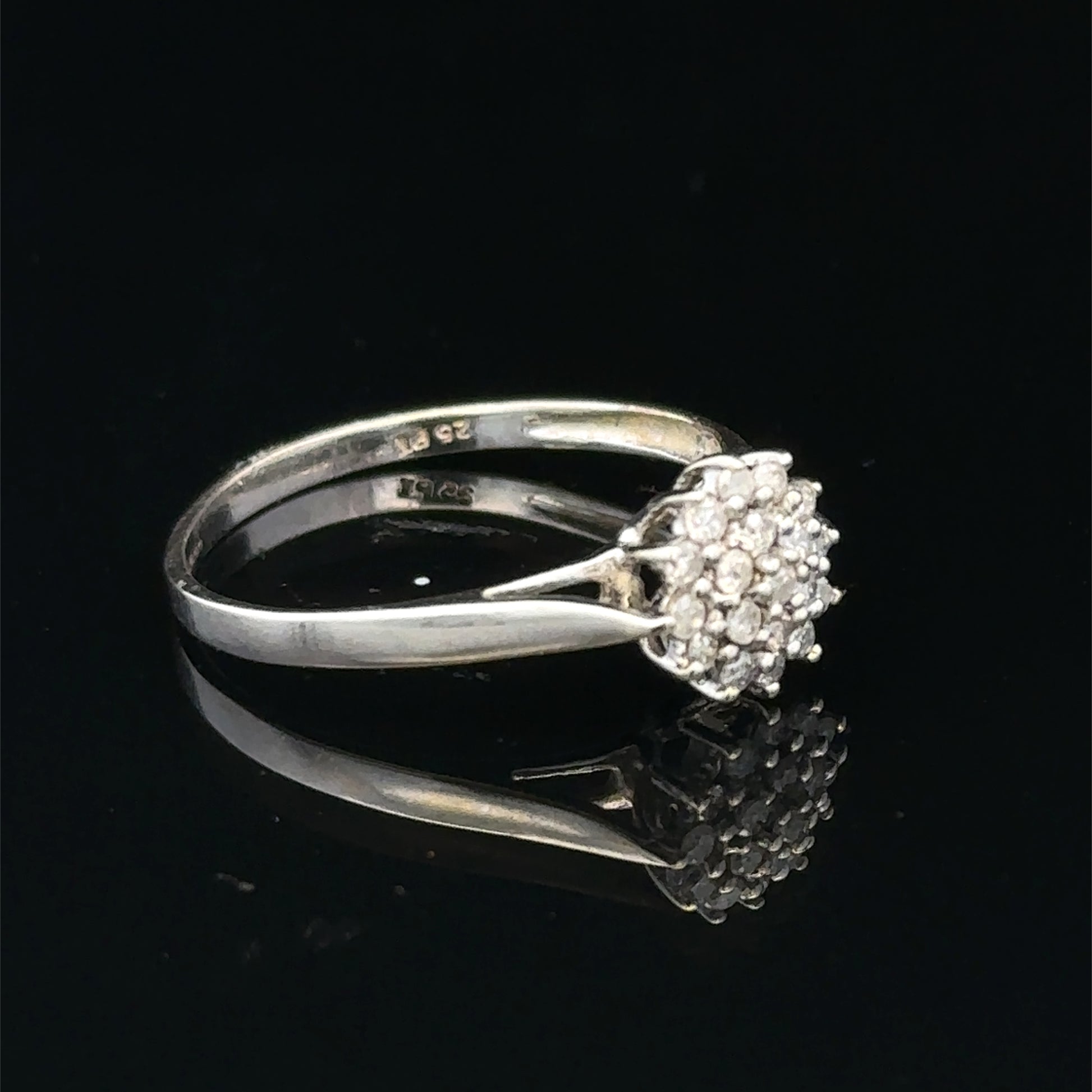 9ct white gold diamond cluster ring by Reeves and Sons, showcasing a sparkling diamond cluster design.