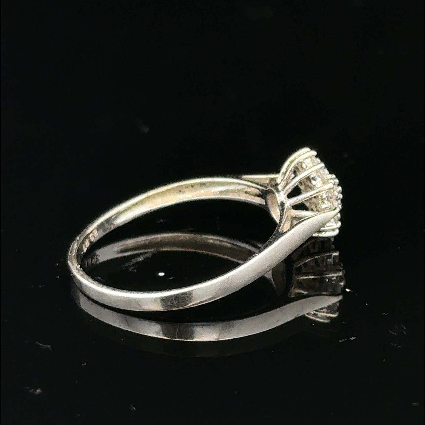 9ct white gold diamond cluster ring by Reeves and Sons, featuring a sparkling diamond cluster design.