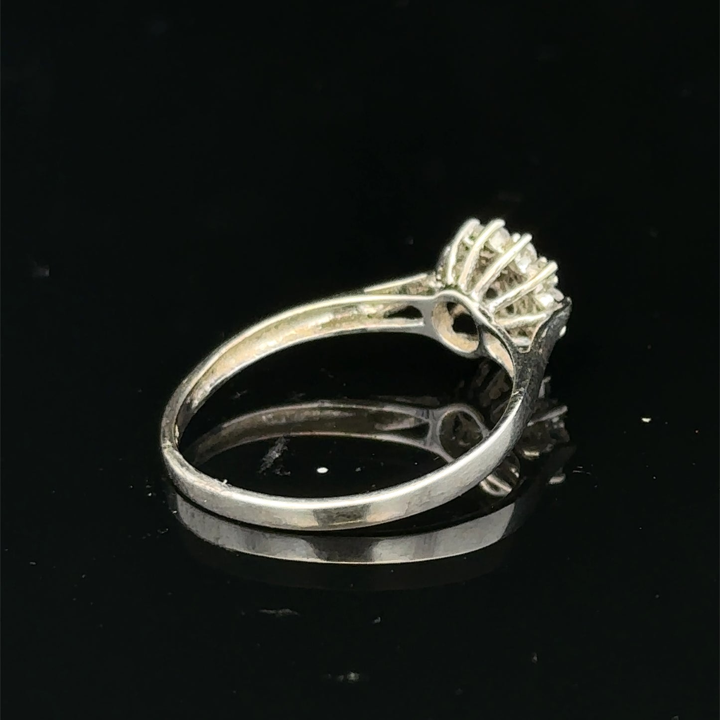 9ct white gold diamond cluster ring by Reeves and Sons featuring a sparkling diamond cluster design.