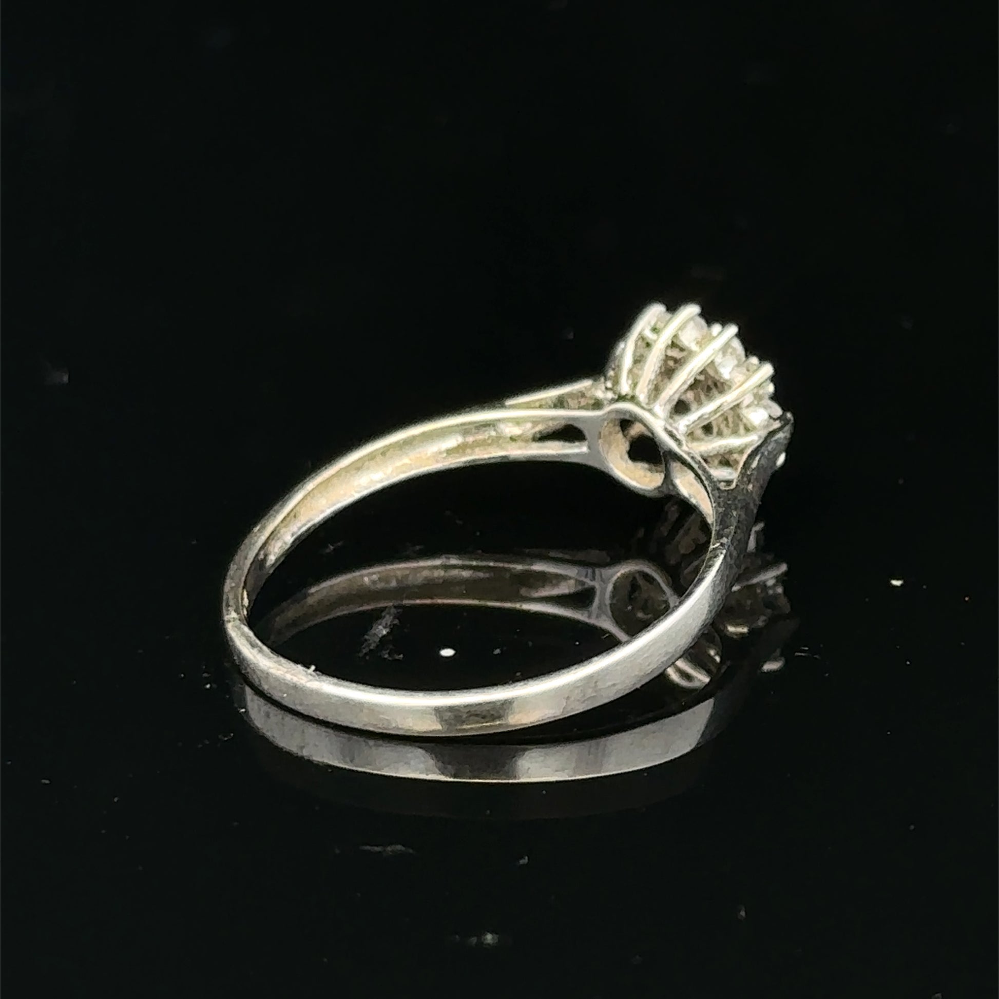9ct white gold diamond cluster ring by Reeves and Sons featuring a sparkling diamond cluster design.