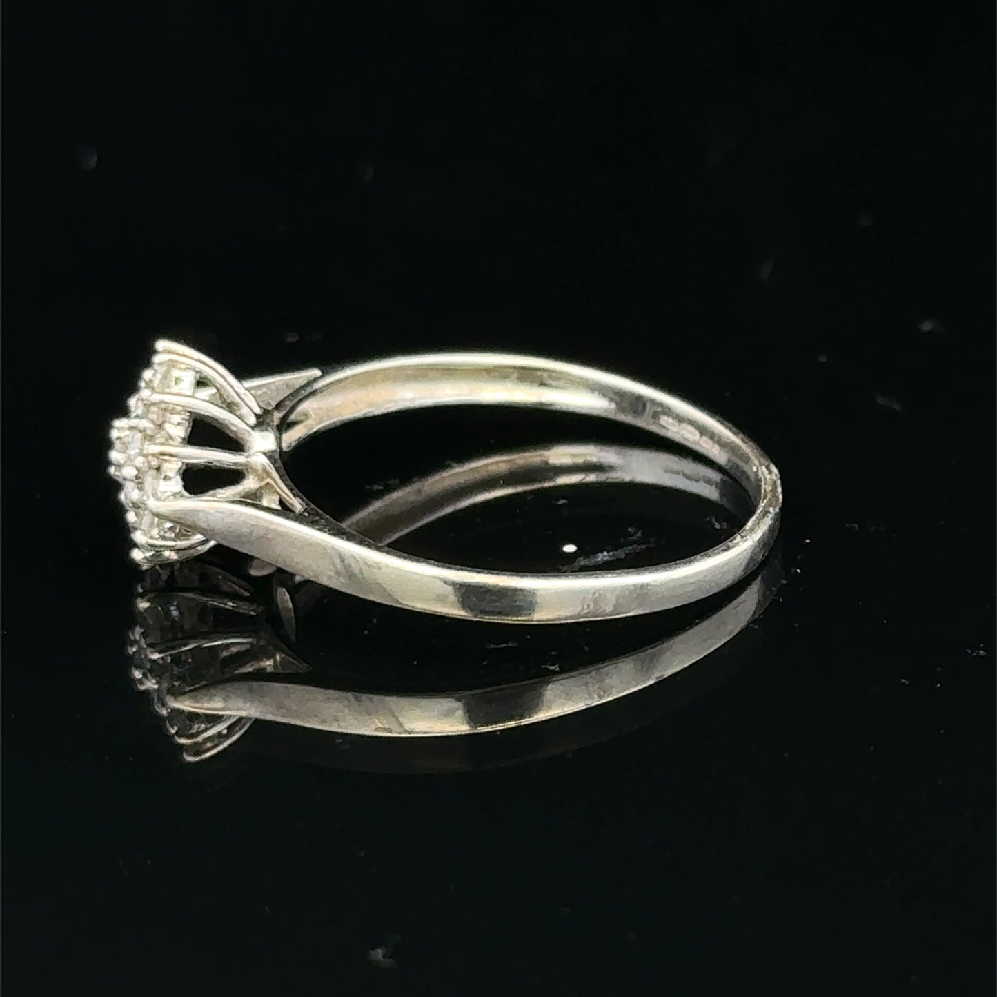9ct white gold diamond cluster ring by Reeves and Sons featuring a sparkling diamond cluster design.