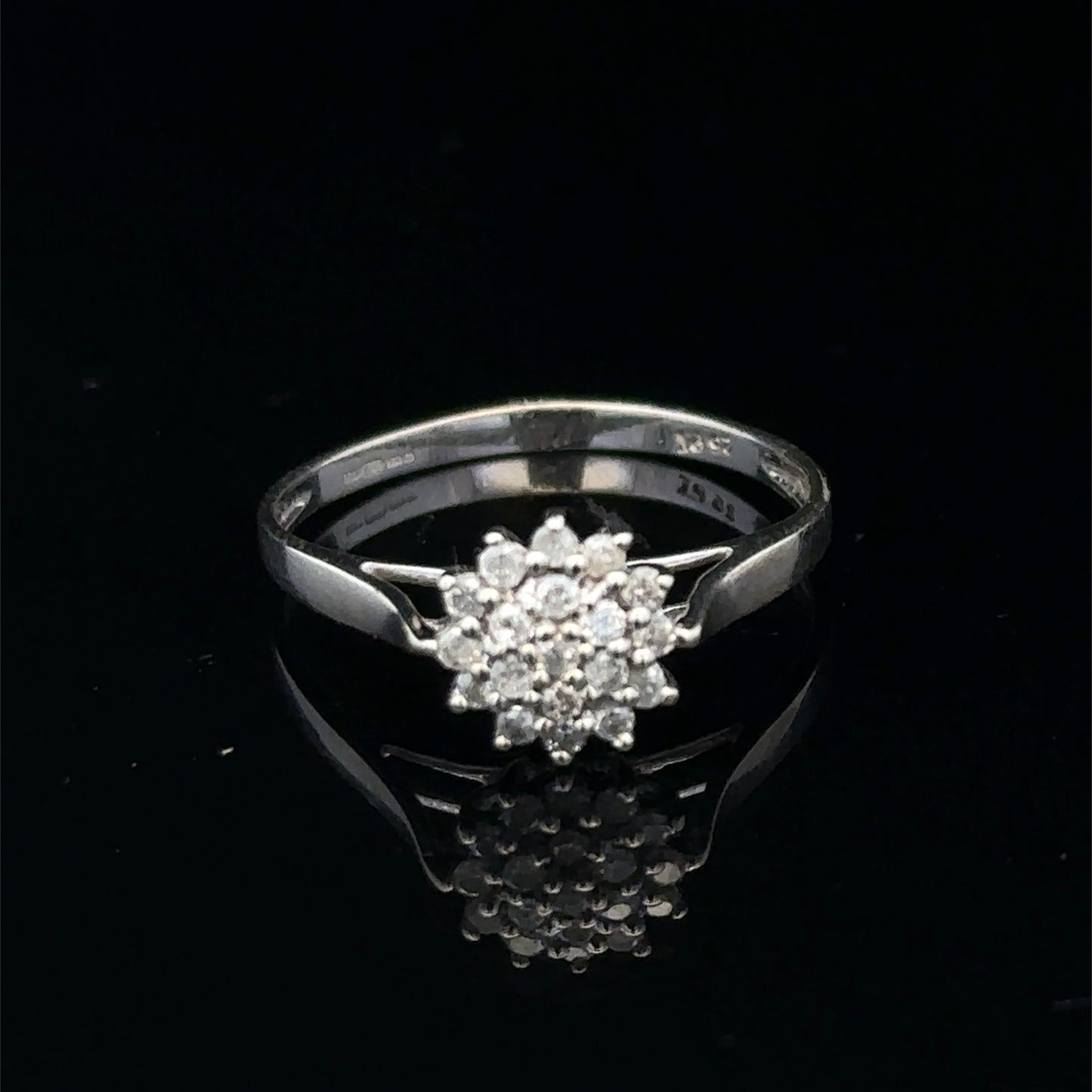9ct white gold diamond cluster ring by Reeves and Sons featuring a sparkling diamond cluster design.