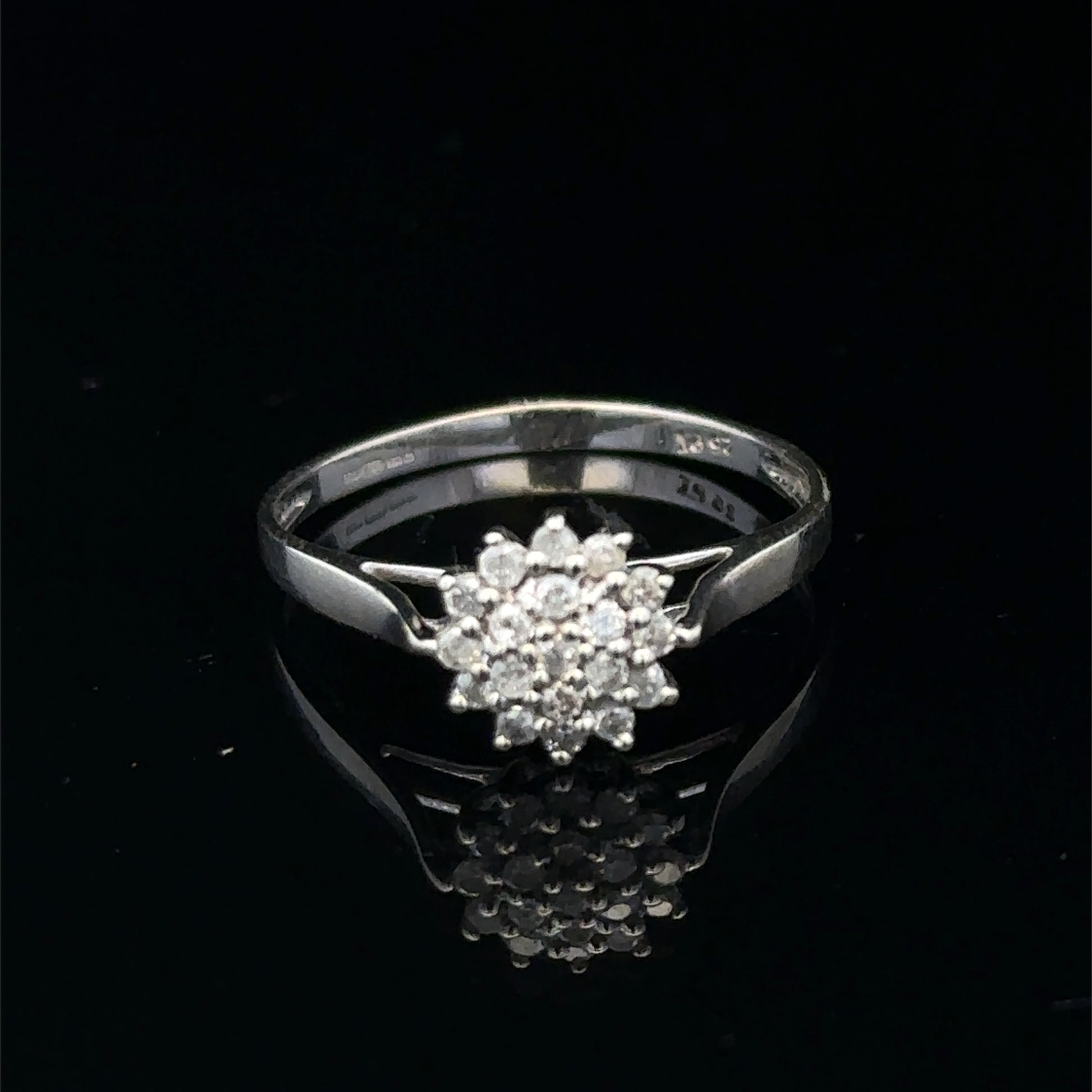 9ct white gold diamond cluster ring by Reeves and Sons featuring a sparkling diamond cluster design.