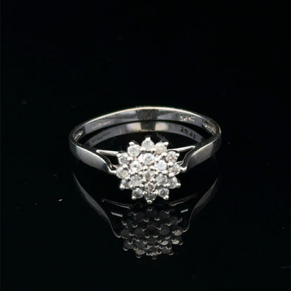 9ct white gold diamond cluster ring by Reeves and Sons featuring a sparkling diamond cluster design.