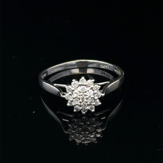9ct white gold diamond cluster ring by Reeves and Sons featuring a sparkling diamond cluster design.