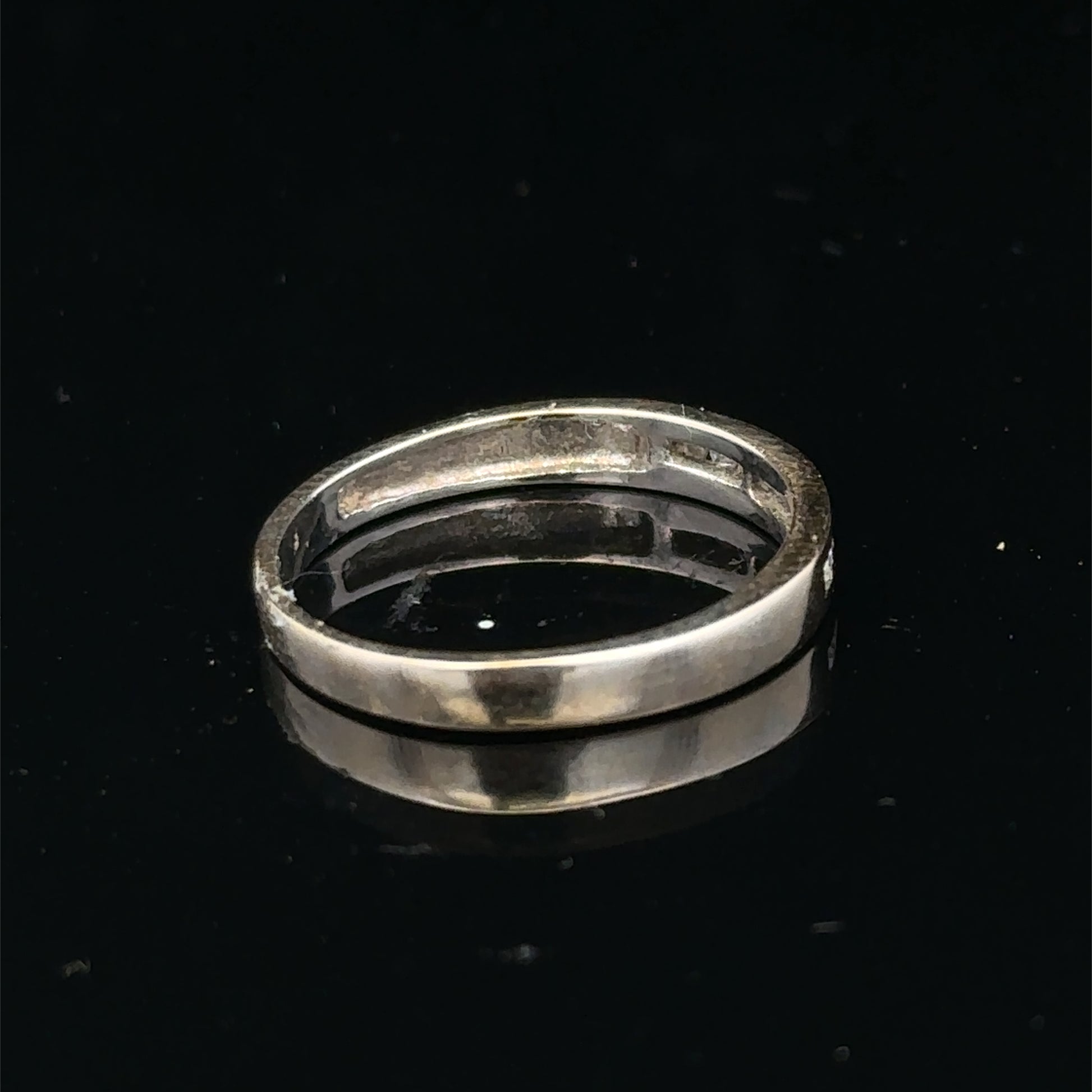 18ct white gold diamond half eternity ring with sparkling diamonds, showcasing elegant design and craftsmanship by Reeves and Sons.