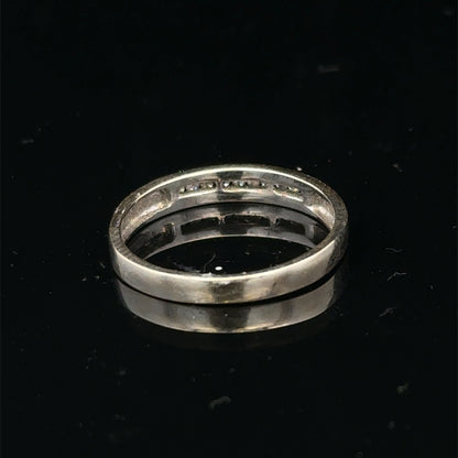 18ct white gold diamond half eternity ring by Reeves and Sons, showcasing sparkling diamonds and elegant band design.