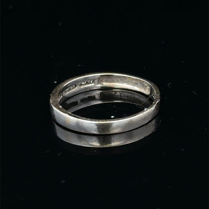 18ct white gold diamond half eternity ring with sparkling stones, crafted by Reeves and Sons, shown on a white background.