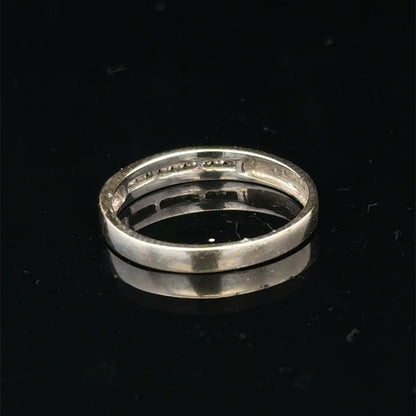 18ct white gold diamond half eternity ring with sparkling diamonds, showcasing Reeves and Sons elegant jewelry design.