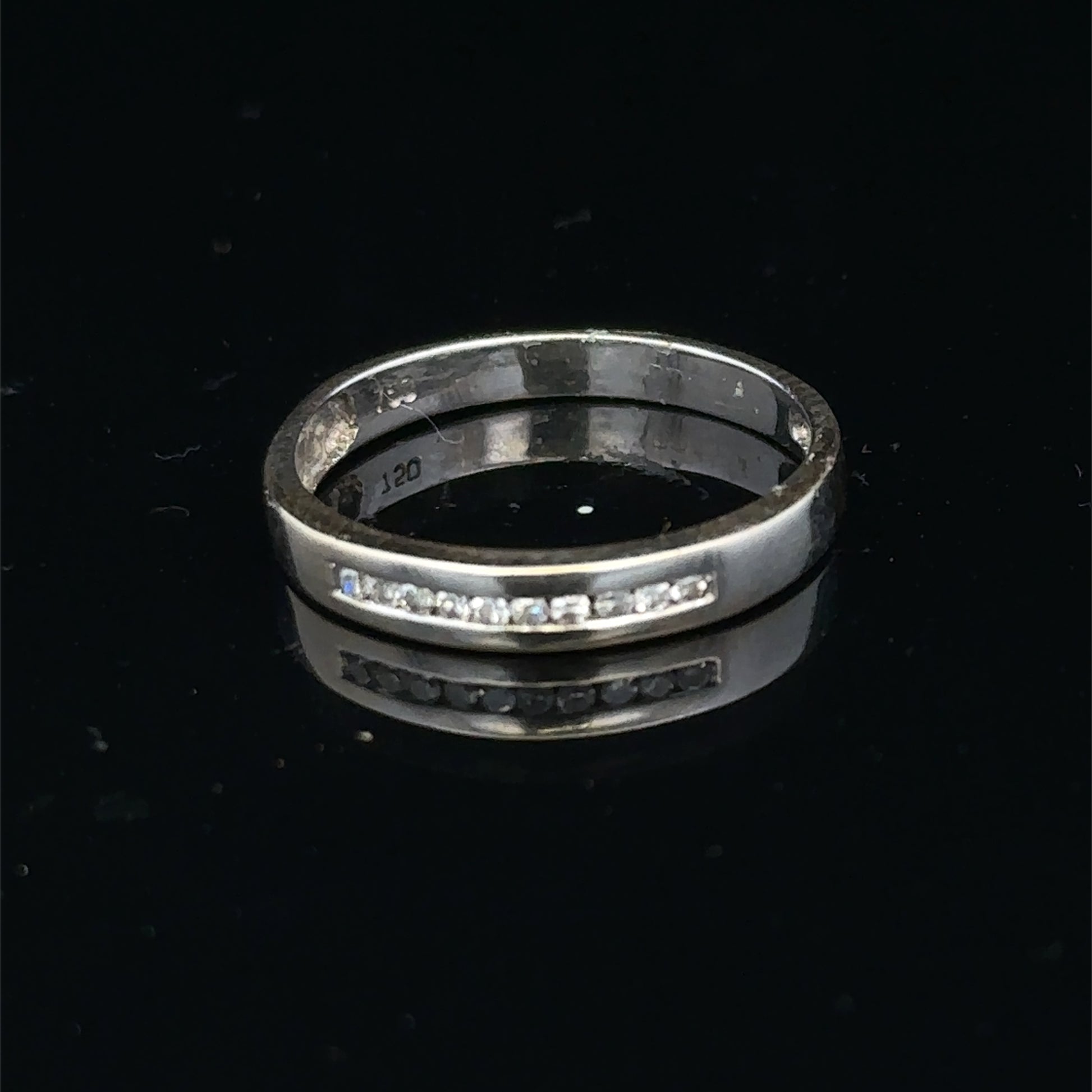 18ct white gold diamond half eternity ring featuring sparkling diamonds set in a sleek band by Reeves and Sons.
