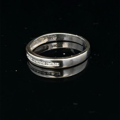 18ct white gold diamond half eternity ring with pave-set diamonds, featuring a sleek band design by Reeves and Sons.
